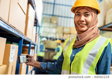 Islam muslim female warehouse worker use mobile 68082228