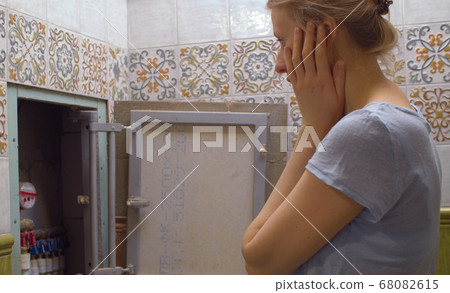 Woman in horror looking at the distribution Woman in horror looking at the distribution 68082615