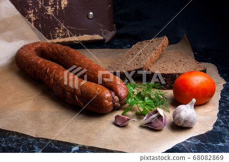 Close up view smoked sausage with spice, herbs and Close up view smoked sausage with spice, herbs and 68082869