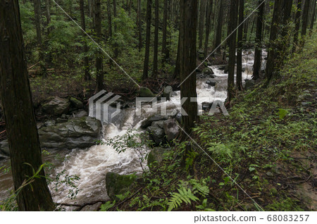 Upstream of the river flooded by heavy rain 68083257