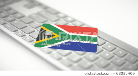 Plastic bank card depicting flag of South Africa on computer keyboard. Fictional numbers 68083409