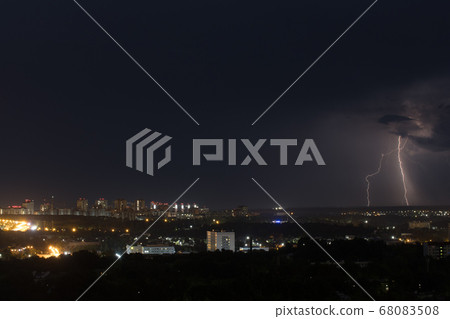 Lightning bolt strike the ground in the city Lightning bolt strike the ground in the city 68083508