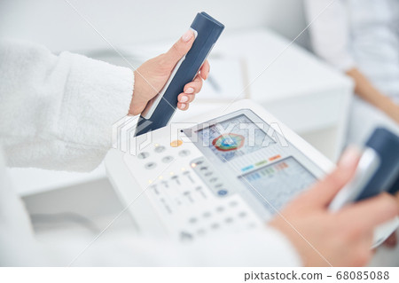 Portrait of woman hands on the modern technology device that showing indicators of the health 68085088
