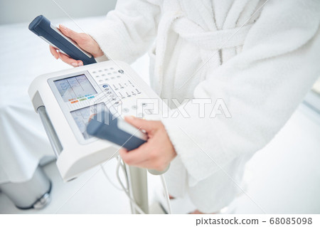 Beautiful female bare hands in order to making skin contact with the machine 68085098