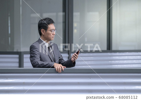 Chinese businessman in business suit and tie Chinese businessman in business suit and tie 68085112