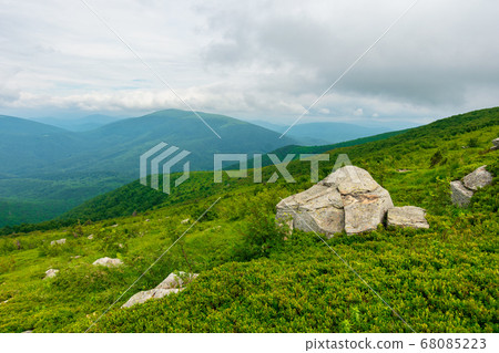 boulders on the alpine hillside. view from the boulders on the alpine hillside. view from the 68085223