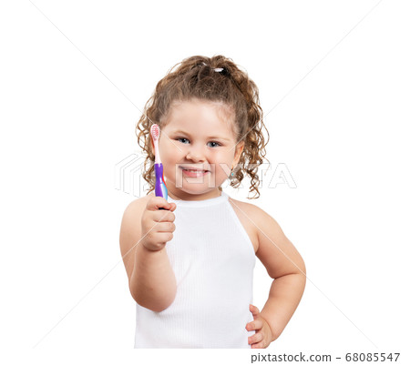 Cute blond girl brushing her teeth on isolated white background. Cute blond girl brushing her teeth on isolated white background. 68085547