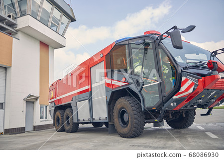 Fire red machine in the outdoors using for emergency situations 68086930