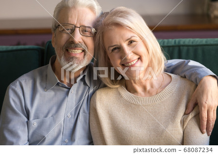Smiling senior couple man and woman bonding, close up portrait Smiling senior couple man and woman bonding, close up portrait 68087234