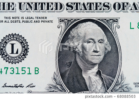 One dollar bill. Closeup of George Washington . US dollars background. American currency. One dollar bill. Closeup of George Washington . US dollars background. American currency. 68088503