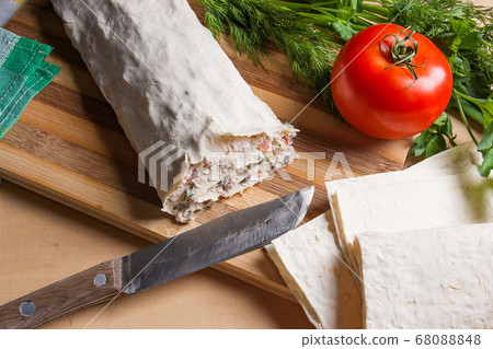 Pita bread or lavash wrapped with cottage cheese Pita bread or lavash wrapped with cottage cheese 68088848
