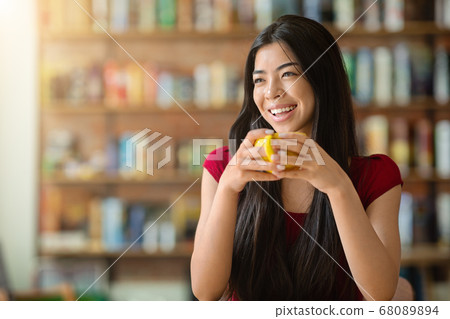 Coffee Break. Happy Asian Girl Enjoying Hot Drink At Cafe, Holding Cup 68089894