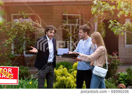 Annoyed customers disputing with realtor about mortgage loan or real estate problem, outside 68090206