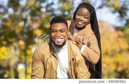 Portrait of happy african american couple posing outdoors 68090892