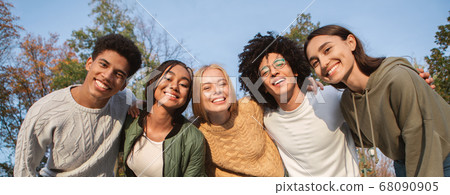 Portrait of overjoyed teenagers having fun outdoors Portrait of overjoyed teenagers having fun outdoors 68090905