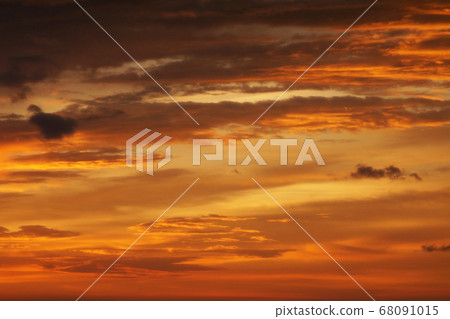 Sunset lighting and orange sky with cloud as 68091015