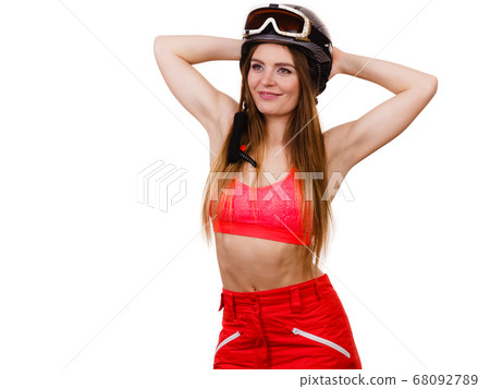 Woman wearing ski suit and helmet with goggles Woman wearing ski suit and helmet with goggles 68092789