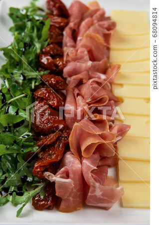 prosciutto cheese and sun-dried tomatoes 68094814