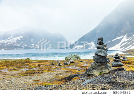 Stone cairns at the Djupvatnet lake Geiranger, 68094881