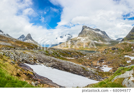 Snowy mountains peaks around Alnesvatnet lake Snowy mountains peaks around Alnesvatnet lake 68094977