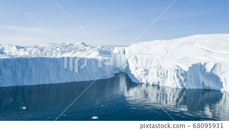Global Warming and Climate Change - Icebergs from melting glacier on Greenland 68095931