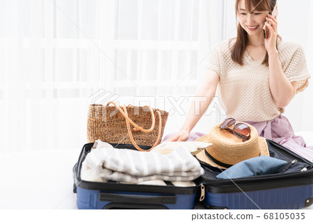 Young woman preparing for an excursion Young woman preparing for an excursion 68105035