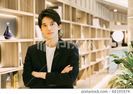 Young man with arms folded 68105874