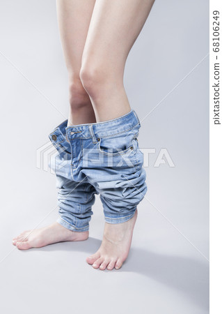 Woman wearing denim pants Woman wearing denim pants 68106249