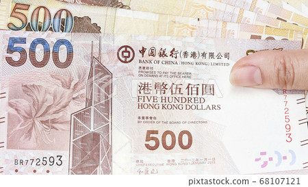 close up of banknote on hand  close up of banknote on hand  68107121