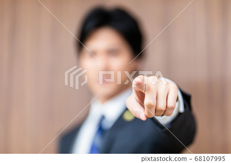 Male lawyer standing in court 68107995