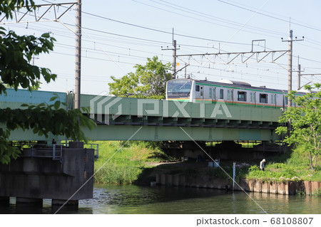 A regular train running on an iron bridge over Motoarakawa, Hasuda City, Saitama Prefecture A regular train running on an iron bridge over Motoarakawa, Hasuda City, Saitama Prefecture 68108807