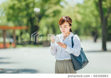 A woman angry with a smartphone A woman angry with a smartphone 68108863