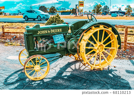 An old tractor stands in the fields of Arizona. An old tractor stands in the fields of Arizona. 68110213