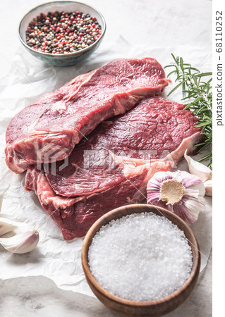 Two Rib eye steak salt spices rosemary and garlic Two Rib eye steak salt spices rosemary and garlic 68110252