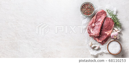 Two Rib eye steak salt spices rosemary and garlic Two Rib eye steak salt spices rosemary and garlic 68110253