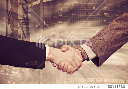 Handshake on background with industrial landscape Handshake on background with industrial landscape 68111580