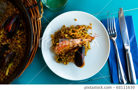 Paella on white plate Paella on white plate 68111630
