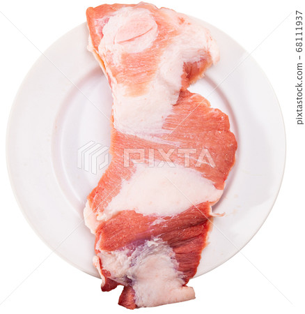 Raw pork cinch with parsley in white plate Raw pork cinch with parsley in white plate 68111937