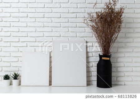 Mock up Empty white canvas frame on table 68113826