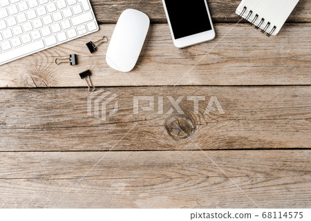 Office desktop with accessories on wooden background with copyspace Office desktop with accessories on wooden background with copyspace 68114575
