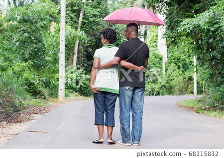 young couple stroll in the countryside young couple stroll in the countryside 68115832