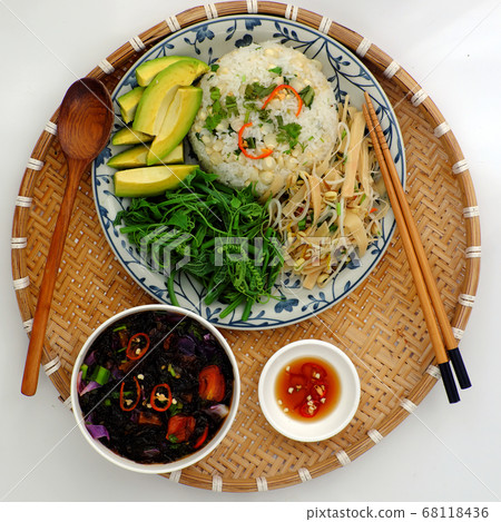 Vietnamese family meal for lunch with vegetarian food, vegetables, avocado with sauce, seaweed soup, vegan dish for dieting 68118436