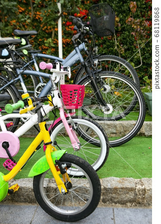 Bicycles in family parking. 68119868