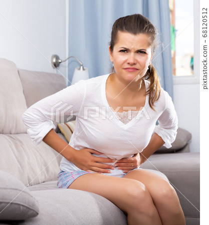 Woman with stomachache Woman with stomachache 68120512
