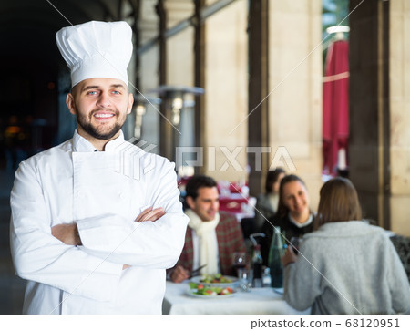 Portrait of handsome male chef standing in restaurant 68120951
