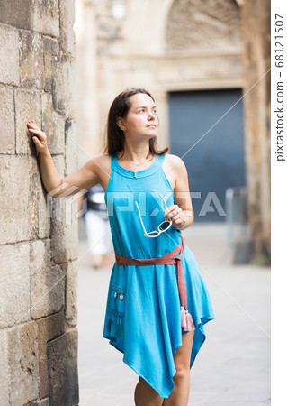 Girl walking in city streets 68121507