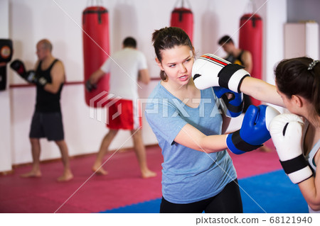 Two athlete girls boxing Two athlete girls boxing 68121940