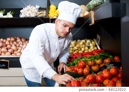 Man cook deciding on best vegetables Man cook deciding on best vegetables 68122022