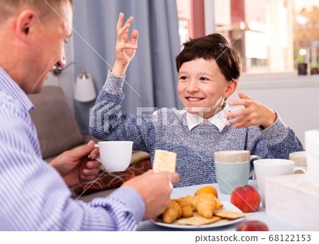 Cheerful boy talking to father 68122153