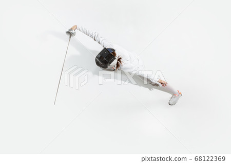Teen girl in fencing costume with sword in hand isolated on white background, top view Teen girl in fencing costume with sword in hand isolated on white background, top view 68122369